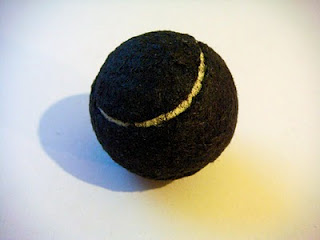 black tennis ball