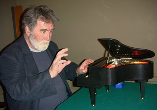 Tom with miniature piano